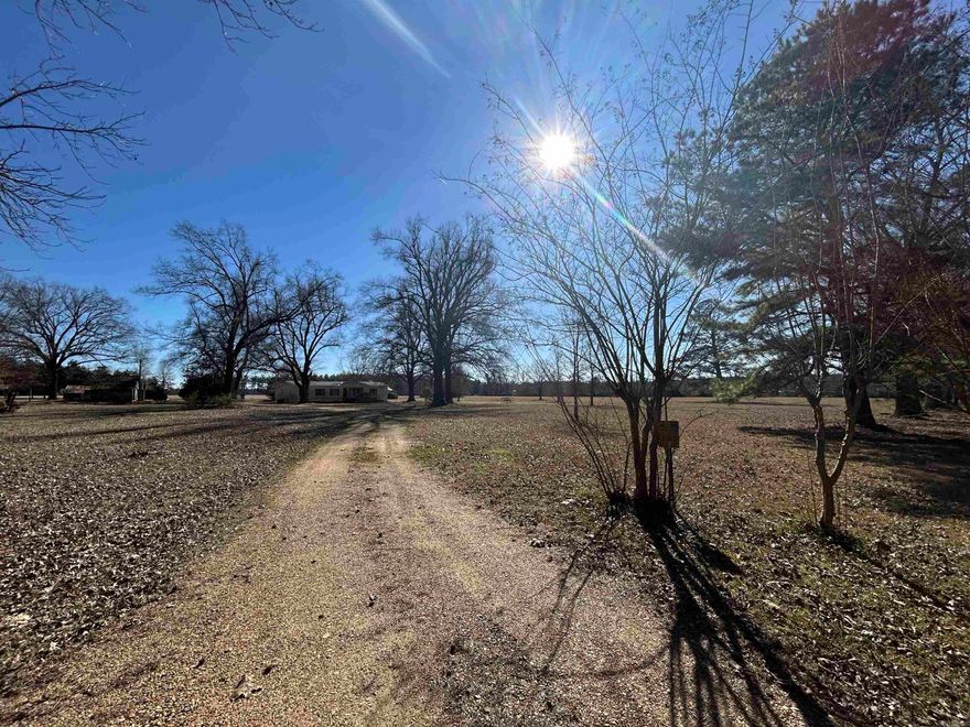 Subject to court approval. 82.28 surveyed acres including Parcel #000-07488-000, Parcel #000-07488-001, and approximately 2.28 acres of Parcel #000-07359-000.  The property offers a blend of wooded acreage and productive hay fields, along with multiple shed and outbuildings. A mobile home is situated on the property and is being sold as-is. Agents see remarks.