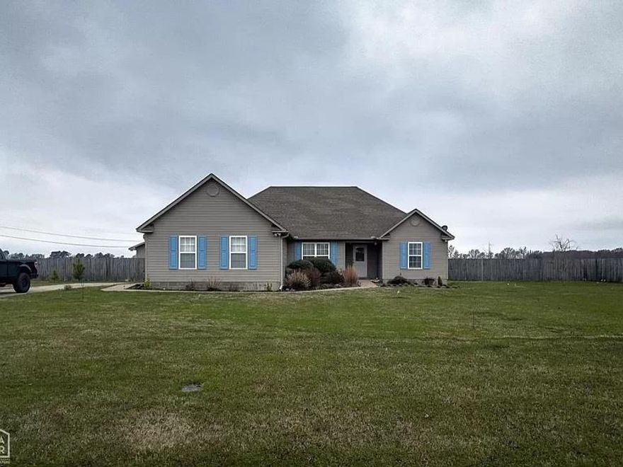 This 3 bedroom, two bathroom, house is setting on an acre lot.  Boasting a 20 X 30 A/C'd shop, a charming greenhouse, and a fully enclosed privacy fence.  This property invites you to enjoy the epitome of modern living.  A new roof to be put on this month 2/24.  This floorplan seamlessly connects the living room, dining room, and kitchen areas.  The kitchen features modern appliances and ample space with a blend of style and functionality.