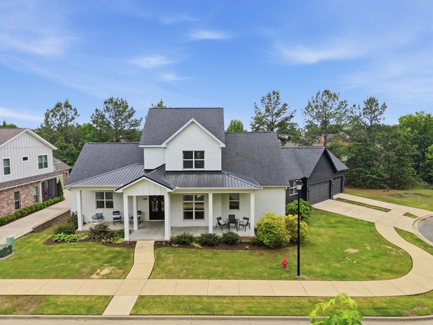 This stunning custom built 4 bed 3 bath Edgewood Park home w/bonus room & office on a large lot at the end of a cul-de-sac w/peaceful views of neighborhood’s shared wooded pond & dock area. The welcoming front porch & double doors open to a beautiful foyer & spacious living area w/10 ft ceilings, large dining space & chef’s kitchen. The kitchen boasts stainless steel appliances, double ovens, gas range, large center island, custom cabinetry, tile backsplash, stunning walk-in pantry w/built-ins, icemaker, beverage refrigerator plus under-stair storage/second pantry. Separate office & laundry room. The generously sized primary suite has luxurious en suite featuring soaker tub, zero-entry walk-in tile shower, marble floors & spacious walk-in closets. Guest bedroom & full bath on the main level. 36-inch doorways & luxury vinyl flooring & tile throughout. The open stairwell w/iron railing leads to 2 bedrooms connected by a bathroom w/double sinks& tiled shower. Great bonus room w/access to 900 ft.² floored walk-in attic. Outside: beautiful landscaping, large front & back porches, separate grill porch & oversized 3-car garage.