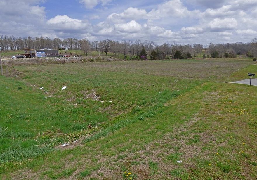 Prime Commercial Property in Great Location! This 2 +/- acre commercial land sits on U. S. Highway 62-412 surrounded by businesses and across the street from the local Walmart. Lots of potential for any type of business as this is a high traffic location. Behind this property there is a plated subdivision. Call for complete details.