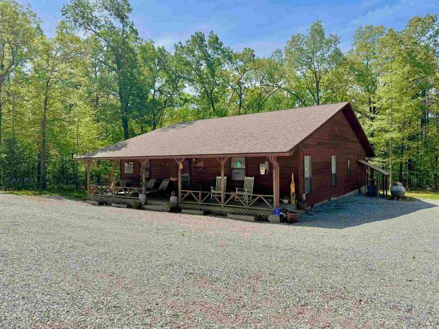 Nestled on 14.36 acres, this well maintained 3-bedroom, 2-bath cabin offers the perfect blend of rustic charm and modern comfort. The living area features vaulted wood ceilings, native stone gas fireplace, and an open-concept design that flows into an updated kitchen, large dining area, and an office nook. The master suite includes an attached full bathroom, both guest bedrooms are spacious, and the open loft upstairs provides flexible space that could easily serve as a 4th bedroom, guest area, or bonus room. Outside, the property truly shines with a 27x36 shop with a 10x12 workshop within as well as 9ftx36ft lean to, a 30x40 barn featuring 4 horse stalls and a tack room, and multiple fenced areas perfect for horses, one including a small pond.  Enjoy peaceful afternoons by the large stocked pond or hiking on the trails throughout the property. Additional features include a carport, a separate storage building, a gazebo, a playhouse, & Fiber Internet! All of this is just minutes from the National Forest, Gunner Pool, & Blanchard Springs offering endless opportunities for outdoor adventure. This is country living at its finest—peaceful, private, and move-in ready!