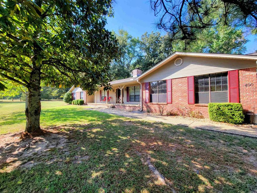 Welcome to this private oasis within the city limits! The 3.81 acres of immaculate land on this magnificent property provide the ideal mix of serenity and potential. You'll find a lovely pond, a versatile shed, Insulated Shop, a pool pad, and even a wonderful playground for kids nestled on this spacious lot.  A warm, welcoming ambiance with vaulted ceilings and a double-sided fireplace welcomes you as soon as you enter. The living, dining, and kitchen spaces are effortlessly integrated by the open concept design, making it the perfect place to host guests or unwind with loved ones. Large windows let in plenty of natural light, allowing you to take in the captivating views of the nearby greenery and wildlife.  This home comes with three bedrooms, two full bathrooms, one half bath, newly installed carpet and roof, fresh paint and more. Schedule your private showing now.