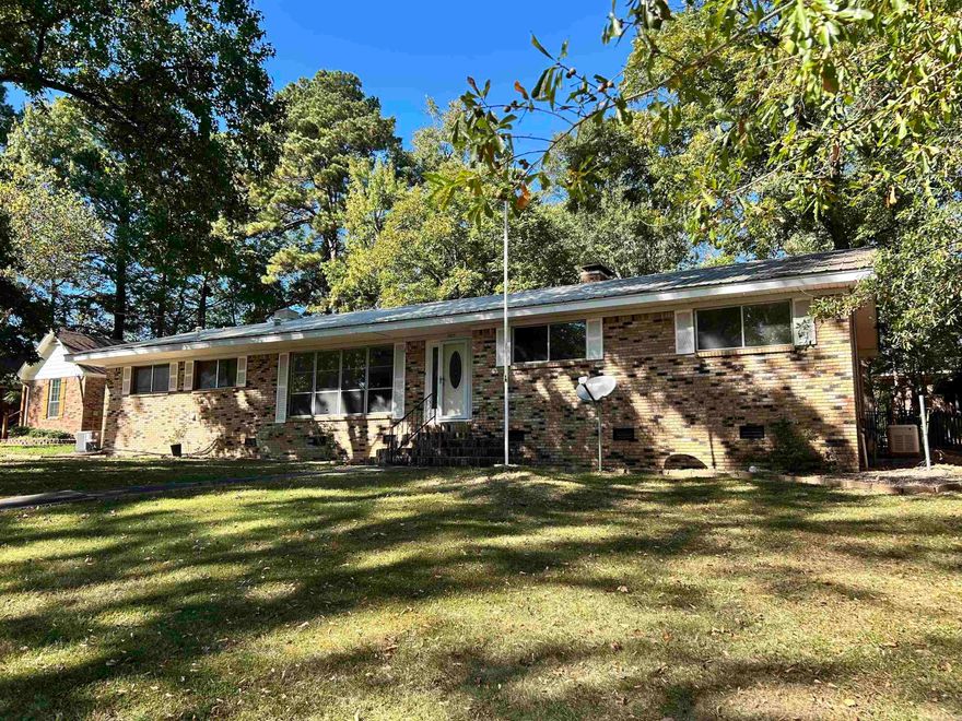 GREAT HOME WITH LOT OF UPDATES. NICE SHADED LOT, COVERED BACK PATIO, HARDWOOD FLOORS THROUGHOUT, WOOD-BURNING STOVE, NEW FRIG & WALL OVEN. WASHER, DRYER & GENERATOR TO CONVEY WITH THE PROPERTY. METAL ROOF. OUTSIDE STORAGE. WORKSHOP AREA IN GARAGE. LAUNDRY ROOM IN GARAGE. HOME HAS SO MUCH TO OFFER. CONVENIENT TO i-30. *** MUST SEE TO APPRECIATE! *** SEE AGENT REMARKS.