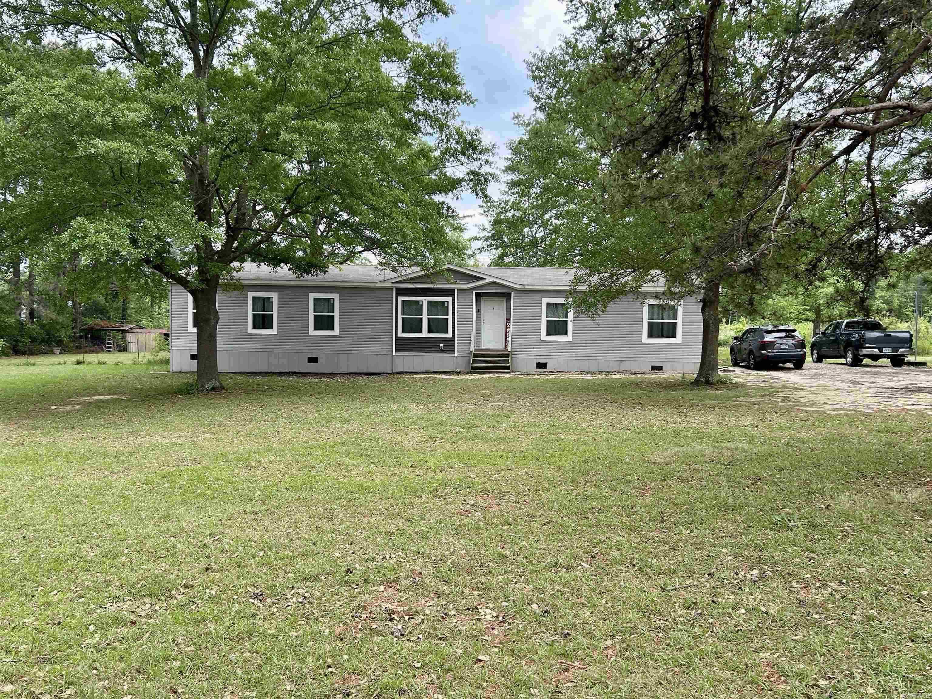 *Back on the due to buyer financing* Come and see this large established lot which already has a second power/gas service set up for a new shop or another home for family or possible rental income. *Brand new dishwasher and water heater. This home features 4 bedrooms, 2 full bathrooms, and a large, open-concept layout perfect for families. The Primary bedroom is very spacious and offers additional space for an office/study or nursery. The primary bathroom has a large walk-in shower and full size soaking bathtub. This beautiful kitchen features expansive cabinet and countertop space. Next to the kitchen is your large living area for your family. There is a separate laundry room also. On the opposite side of the home you have three spacious bedrooms and a full bathroom. Transferable manufacture home warranty remaining until 8/19/2026 included. Plant a large garden or just sit back and enjoy your beautiful two acres. ***The property does have two separate address. 10225 and 10235.*** New Survey! The property does qualify for Rural Development loan
