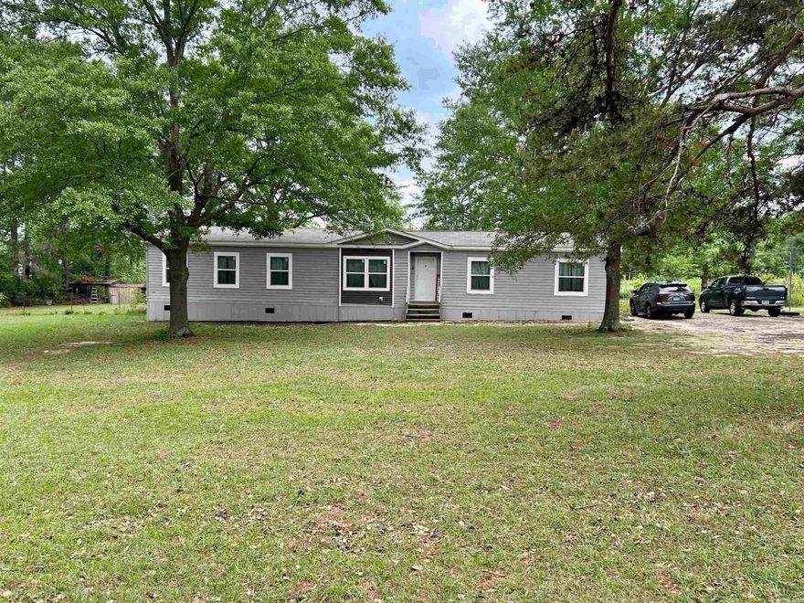 *Back on the due to buyer financing Again*** Come and see this large established lot which already has a second power/gas service set up for a new shop or another home for family or possible rental income. *Brand new dishwasher and water heater. This home features 4 bedrooms, 2 full bathrooms, and a large, open-concept layout perfect for families. The Primary bedroom is very spacious and offers additional space for an office/study or nursery. The primary bathroom has a large walk-in shower and full size soaking bathtub. This beautiful kitchen features expansive cabinet and countertop space. Next to the kitchen is your large living area for your family. There is a separate laundry room also. On the opposite side of the home you have three spacious bedrooms and a full bathroom. Transferable manufacture home warranty remaining until 8/19/2026 included. Plant a large garden or just sit back and enjoy your beautiful two acres. ***The property does have two separate address. 10225 and 10235.*** New Survey! The property does qualify for Rural Development loan