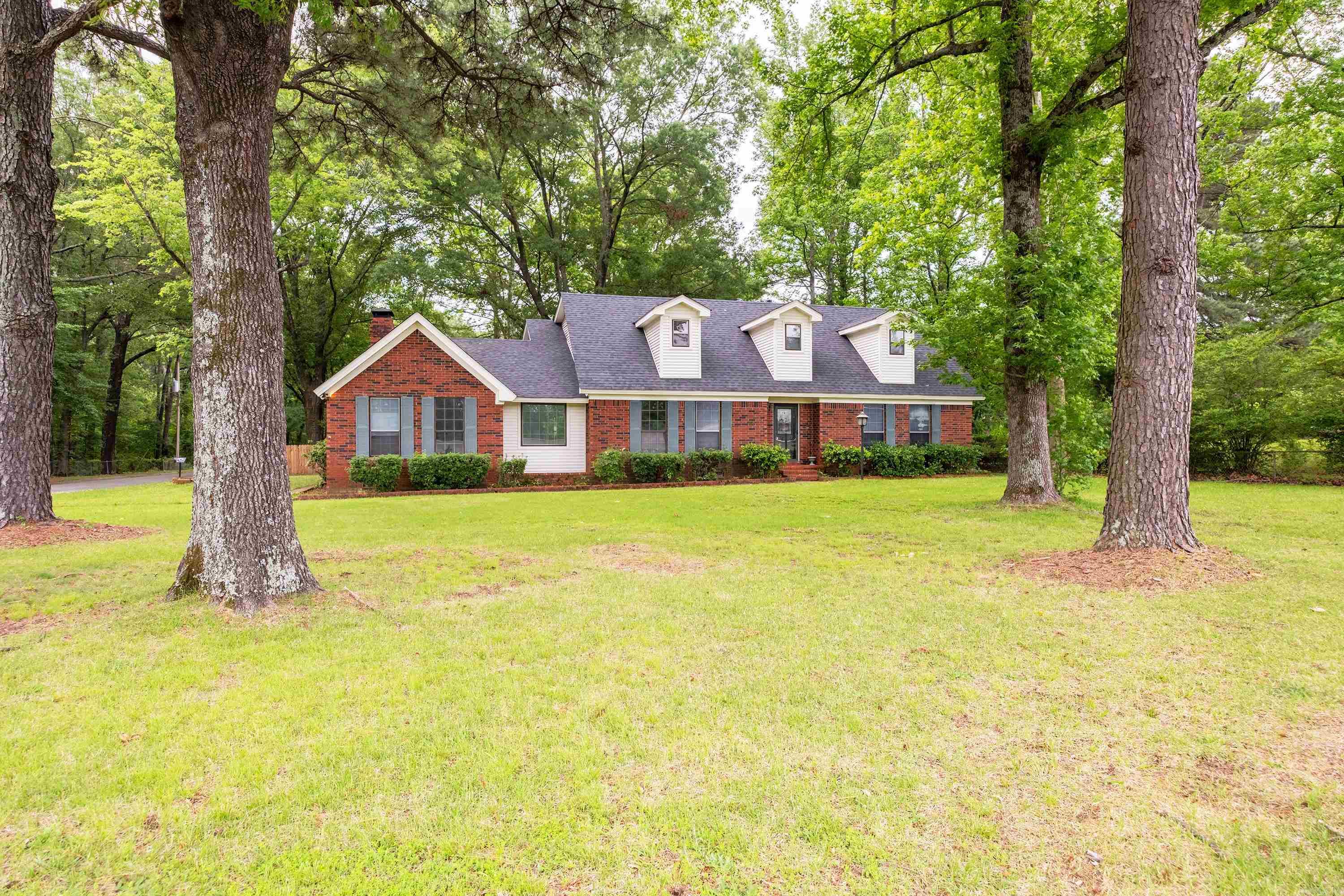 Step into this spacious and beautifully renovated two-story home, complete with a stunning two-story porch and deck that overlook a massive lotāover half an acre of outdoor space. Inside, the great room boasts soaring vaulted ceilings and a striking custom lodge-like, rock fireplace, creating a warm and impressive focal point. The kitchen and bathrooms have been updated. Upstairs, you'll find a convenient laundry chute and one of two master suitesāperfect for flexibility in living arrangements. The second master suite is located on the main level, ideal for guests or multigenerational living. In 2010, 1,250 sq ft was added to the rear of the home, significantly expanding the living space. The versatile floor plan offers excellent potential for an in-law suite or a spacious private home office. With ample room throughout, this home is perfect for remote work and comfortable shared living. Donāt miss the chance to own this one-of-a-kind propertyāschedule your showing today!