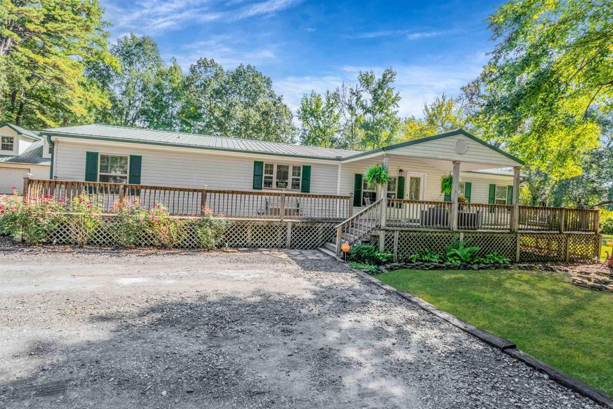 30x40 TWO-STORY SHOP with 16x40 upstairs space that is partially insulted, 1.79 ACRES +/- in the heart of Cabot!! This adorable mobile home is well maintained and updated with beautiful gray tile flooring, kitchen has nice center island, breakfast bar and formal dining area! The master is split with His/Her Vanities, Walk-in Shower & large garden tub! You cannot forget about the amazing front covered porch & large deck on back for entertaining! Fairly new HVAC and Metal Roof! Storm Shelter & 12x16 Morgan w/ Lean-too!! Dont miss out! This is country living in the middle of Cabot, close to shopping and schools.