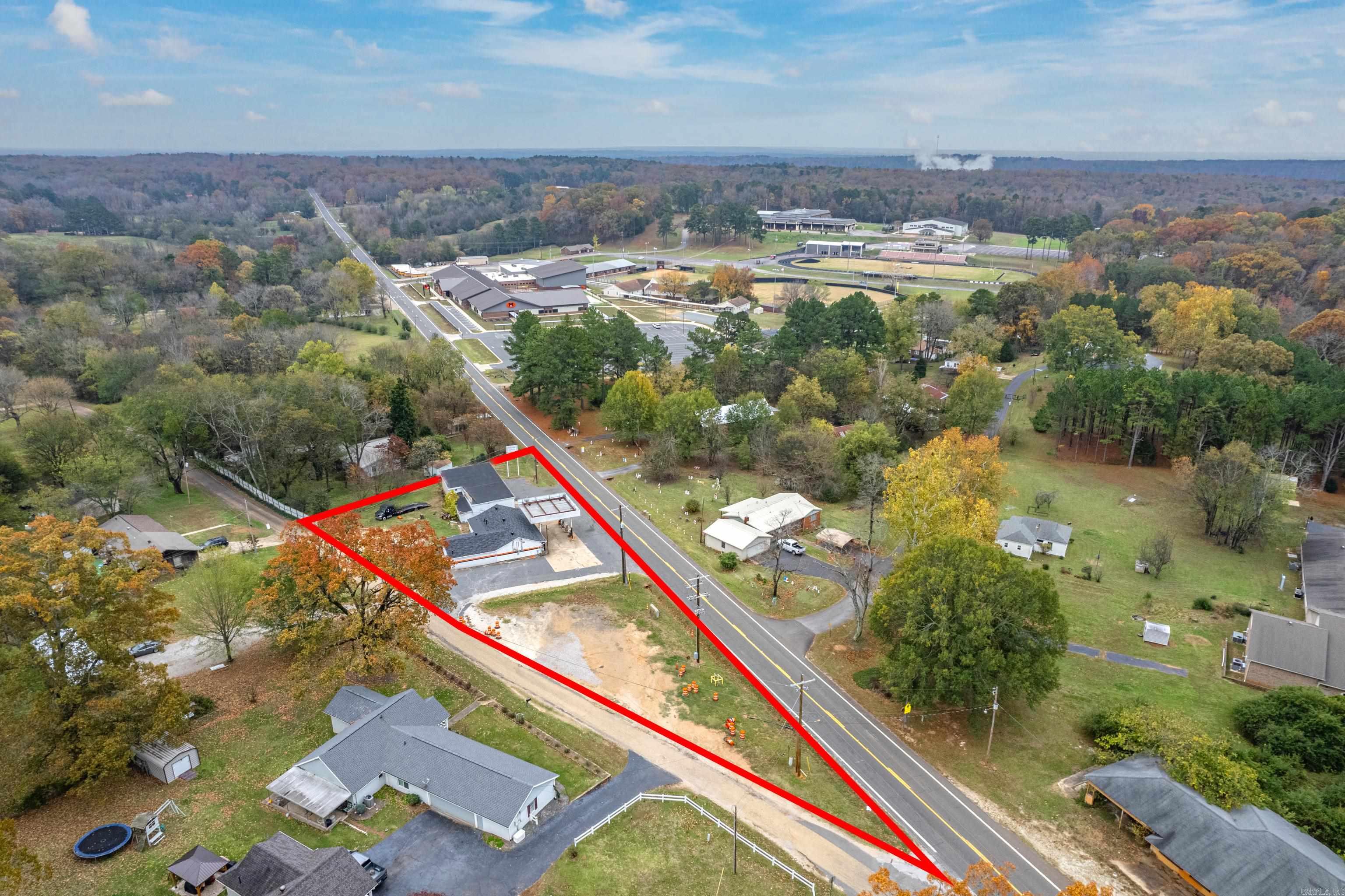 What an opportunity! Approximately 492' on Highway 51 across from Magnet Cove School. This property has so much potential! The main building is approximately 2,142sf and has previously been run as a gas station, grocery, and restaurant. Great commercial kitchen area with fixtures to get started quickly. 2 8,000 gallon gas tanks are underground and pumps are operational. Next door is an approximate 2,281sf building with 4 overhead doors with lots of space to run a shop or remodel to be something new for the community. There is also undeveloped land for extra parking, food trucks, etc...opportunities are everywhere.