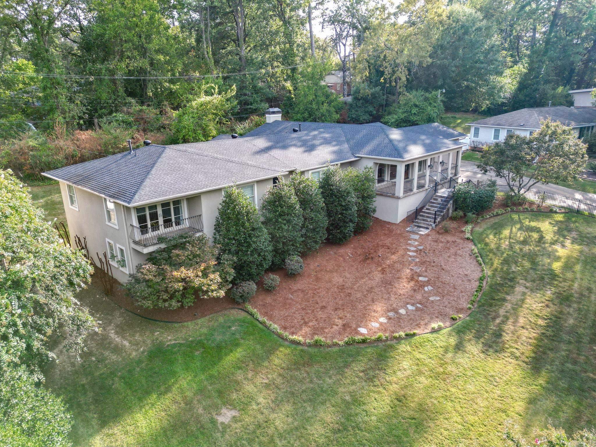 This detailed beautiful home checks all the boxes and is designed for a large family or multiple guests. The grand, open kitchen boasts a large gas range, Viking double oven, ice machine, built-in Viking microwave, Viking wine cooler, stand alone Sub Zero refrigerator and freezer. Five of the six bedrooms have their own private bathroom, and the sixth has a Jack and Jill. The main has a walk-in steam shower, soaking tub, two separate walk-in closets, and an office with a balcony. The home sits on a large lot with a patio out back, and there is a vacant lot connected with the property just waiting for your personal touch. Both the roof and A/C unit was replaced in Aug 2023. Call today and schedule a showing.