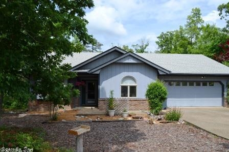 A quiet cul de sac in Mid-Village location near the Coronado Center and Lake Coronado. The one-level home boasts a sunny Arkansas room great for indoor plants. Split bedroom floor plan with two bedrooms on the street side and owner's suite facing the rear deck. Walk out through the french doors to the freshly painted deck area and hot tub to enjoy the wooded view. Water heater replaced June 2014. Seller will credit Buyer a $700 flooring allowance on an acceptable offer.