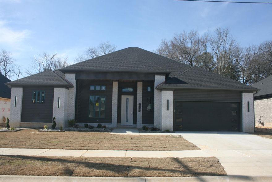 Best location in Bryant - Creekside Subdivision.  3 bedroom, 2.5 bath. Clean modern style home with high ceilings, office/flex area, 2 fireplaces, tankless water heater, gutters and more.  (NEW STREET: TO GPS- use 6150 Creekwater).