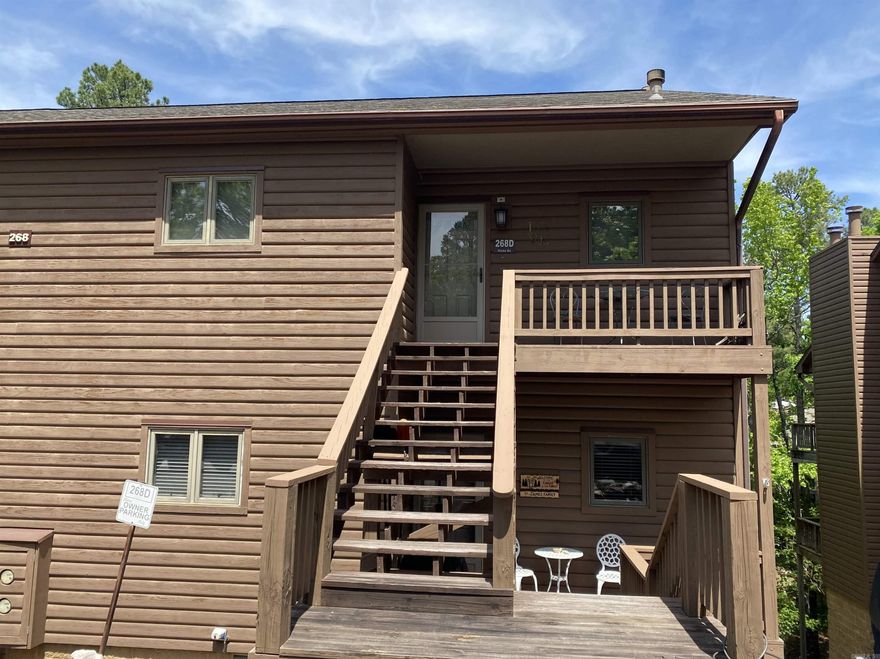 This is what you have been waiting for! 2 bedrooms, 2 baths, approx. 1024 sq ft, in this upper-level condo located in the Mountain Harbor community on beautiful Lake Ouachita.  The living area features a vaulted ceiling, wood burning fireplace and abundant natural light creating a spacious and airy feel. Step outside to the large, fully covered back deck, which is perfect for relaxing year-round, entertaining guests or just enjoying the natural setting.  Not all condos this size have this large, fully covered deck! Priced right to leave room for you to make any updates you may or may not want.  Don't miss this incredible opportunity to have your very own Lake Ouachita getaway!