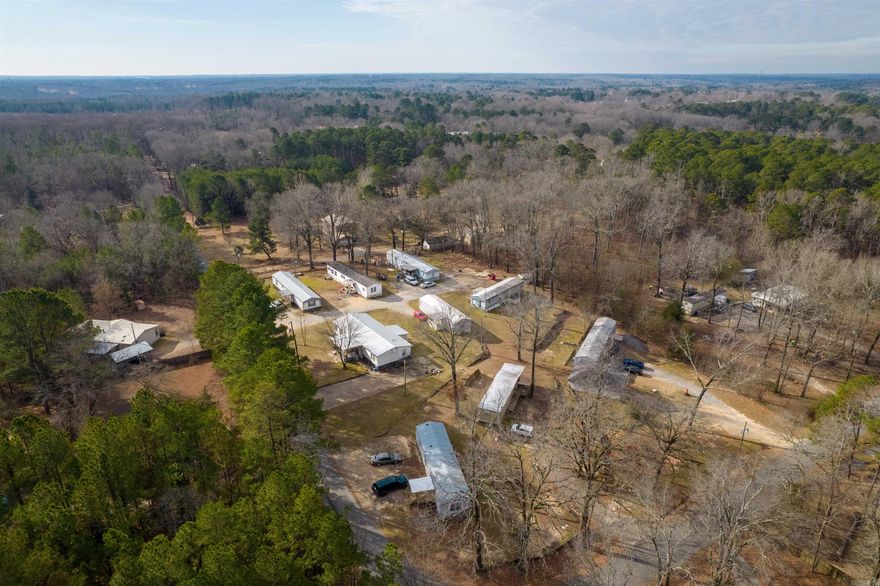 INVESTORS!!! 9 Mobile homes that stay rented all the time. Looking for a great location and nice mobile home park, look no more!! Lots of recent updates. There is an additional spot for another mobile home to put in or RV rental spot. Unsure if the septic is usable on the 10th space. Shop to keep all your supplies inside. This mobile home community has been well kept and maintained throughout the years. Call me today to schedule your private tour. By appt only and must show proof of funds!