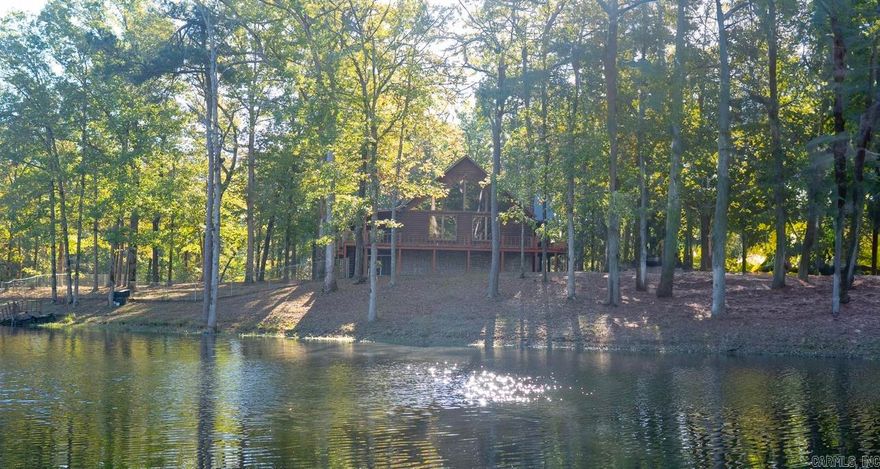 Escape to your own private paradise with this stunning log cabin nestled on a 12 acre property, complete with a serene pond. This property features a generous 2,050 square feet featuring 4 bedrooms, 2 baths, an open concept with tall ceilings an ample natural light. There is also a full basement for additional storage or potential expansion.   Give me a call or text today to setup a private tour.   *Square footage and year built taken from courthouse records.