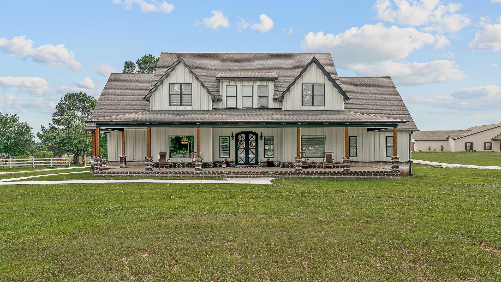 This modern farmhouse offers effortless elegance and thoughtful design on 1.75 acres of serene countryside. The main level features a luxurious primary suite with a tiled shower outfitted with three shower heads (rain overhead) and a Jason Spa microsilk bath. A smart walk-through closet leads directly to the laundry room, equipped with double vanities and utility sink for maximum convenience. The gourmet island kitchen is a chefās delight, complete with soapstone and granite counters, walk-in pantry, custom trim and glass-paneled cabinetry. An additional officeāframed by double glass doorsāoffers the perfect work-from-home sanctuary. Upstairs, two spacious bedrooms, a full bath, and a bonus/flex room provide comfort and versatility for guests. Step outside to your expansive covered patio, ideal for morning coffee or evening entertaining, and park your vehicles in the three-car garage, dual-end doors, and fully heated/cooled third bay. A tankless water heater ensures efficiency and endless hot water. Every corner of this home reflects qualityāfrom meticulous trim work and premium fixtures