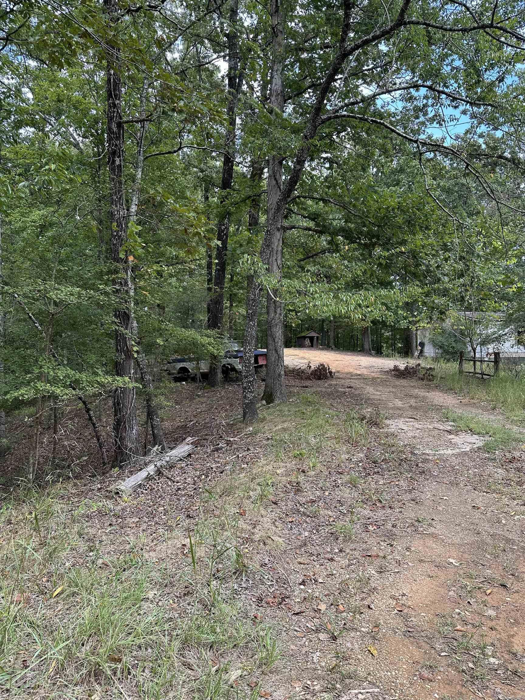Vacant land with 2 mobile homes on property.