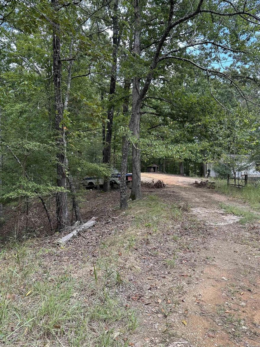 Vacant land with 2 mobile homes on property.
