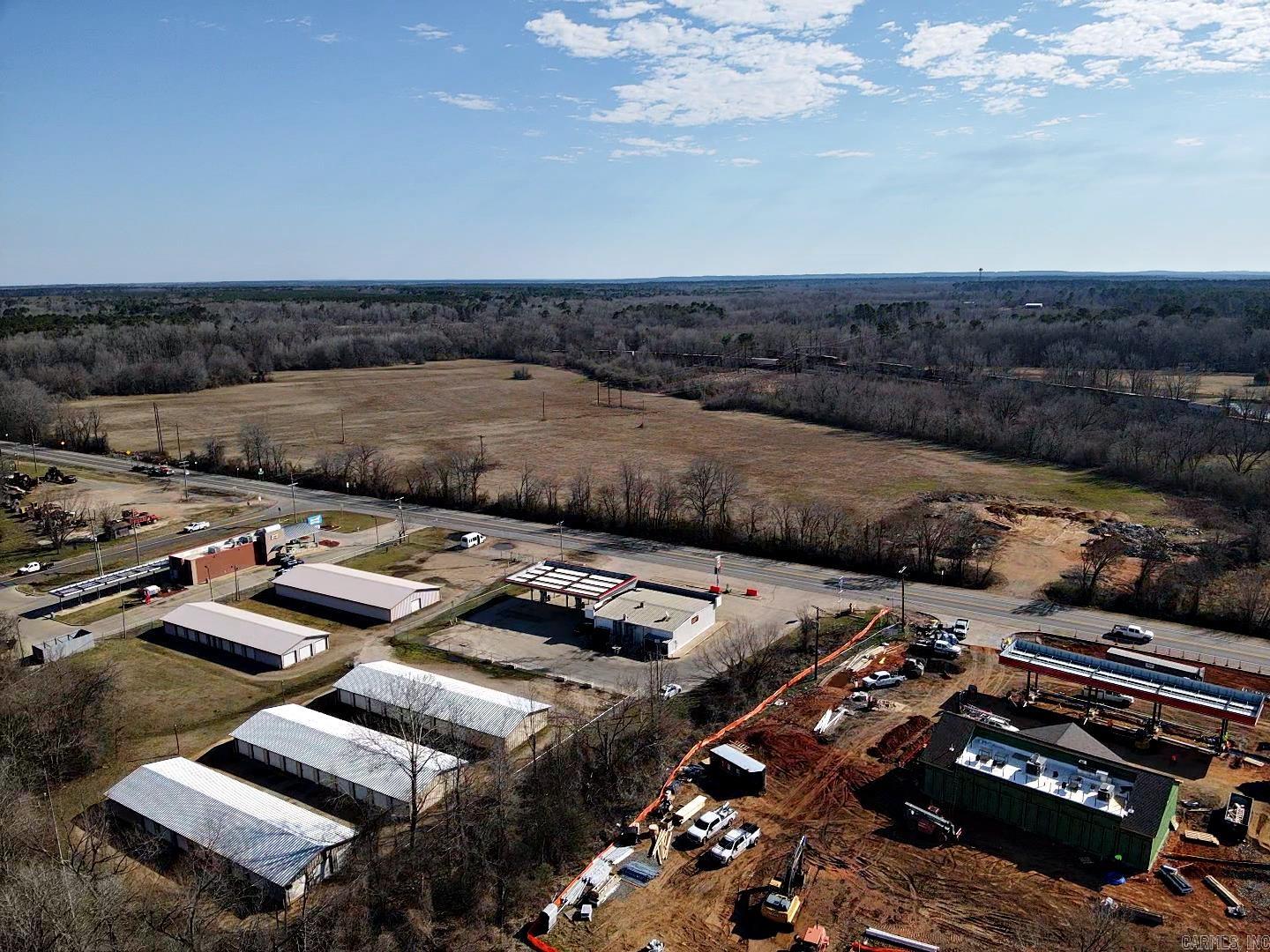 A 57.00 AC+/- property with Highway 67 and Front Street access. Caney Creek runs through; hardwoods with pasture along the road frontage. Electricity, fiber internet, and municipal water are at the right of way. The property is in the floodplain, however, a portion could be developed into commercial or residential using dirt from the property.