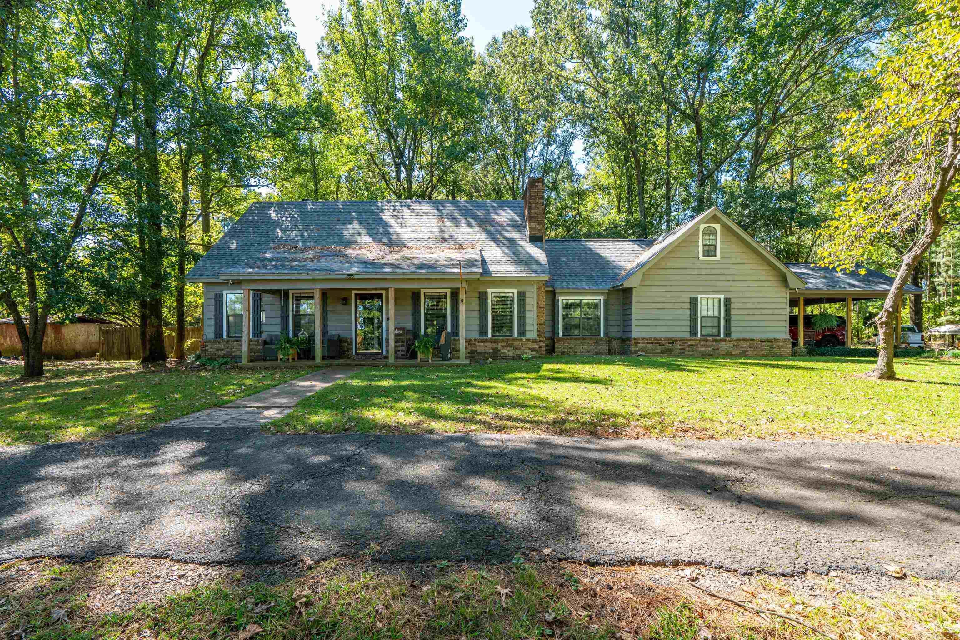 Charming Two-Story Home on 2.42+/- Acres ā 7104 HWY 67, Gurdon, AR Set back from the road beneath a canopy of mature trees, this beautiful 4-bedroom, 3.5-bath home welcomes you with warmth and character. The long, shaded drive leads to a home that combines classic style with thoughtful modern updates. Inside, youāll find a spacious layout with multiple living areas, perfect for both entertaining and everyday comfort. The newly renovated primary suite is a standout featureāoffering a generous bedroom retreat and a luxury bath with a stunning tiled shower. Additional bedrooms provide plenty of space for guests or flexible use as an office or hobby room. A light-filled sunroom brings the outdoors in, ideal for enjoying morning coffee or relaxing while overlooking the backyard. The covered back porch extends the living space outside, where you can unwind and take in the sweeping view of your private yard. Outdoors, the 2.42+/- acre lot provides a shaded, park-like setting with room to roam. The fenced backyard makes it perfect for pets, gatherings, and outdoor activities, offering plenty of space to enjoy. The small shop with lean-to offers a versatile space for tools & storage.
