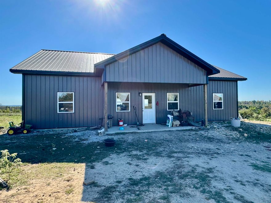 New home on 70 acres near Calico Rock! Home is unfinished. Property mostly pasture with 1 pond! Fenced and cross fenced.