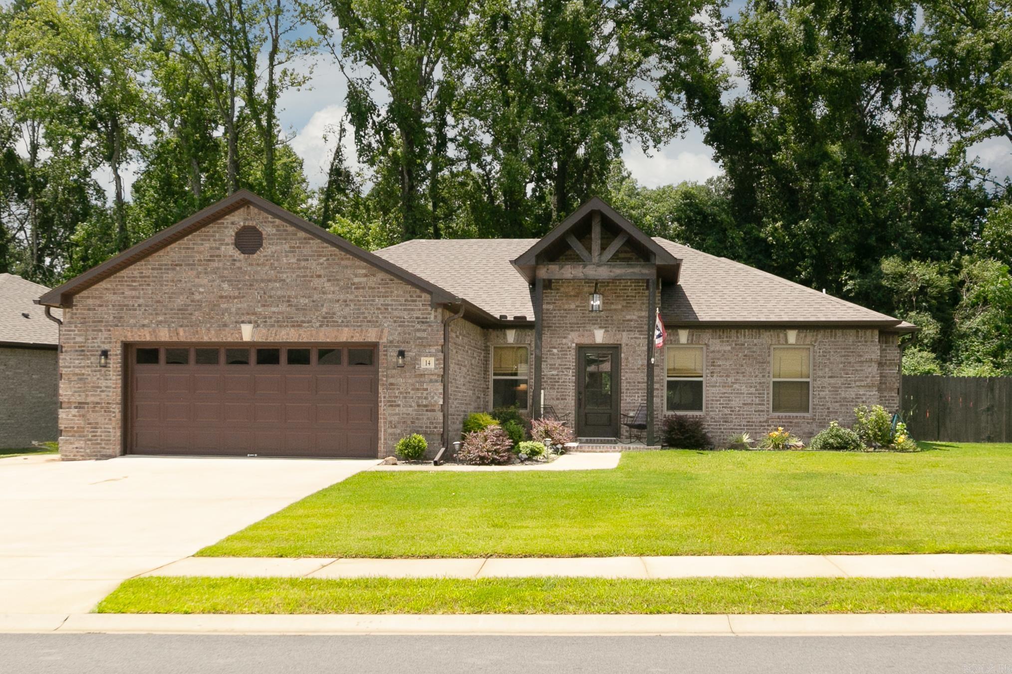 Beautiful 4 bedroom, 2 bath home in Autumn Brooke has open floor plan with custom features throughout. Large living room with fireplace, coffered ceiling, vinyl plank flooring, crown molding. Kitchen has gorgeous granite, an island, tiled backsplash, stainless appliances including refrigerator, dining area. Pretty light fixtures! Primary bedroom is apart with tray ceiling, large walk-in closet, bathroom has 2 sinks, separate tub/shower. Laundry room with washer/dryer conveying. Large covered patio with fully fenced in back yard. Backs up to woods! Extra parking pad. So much to love!
