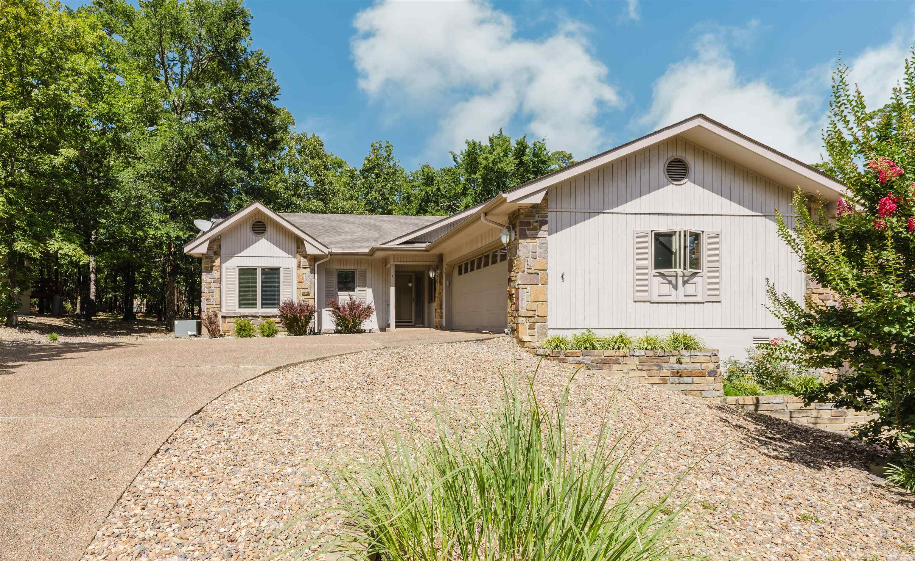 GORGEOUS, Updated and MOVE IN ready home in a great location in the Village. You will fall in love when you pull into the driveway. The curb appeal is AMAZING! Extra landscaping, side entry garage and extra wide pebbled concrete driveway. Step into this open concept home with beautiful laminate flooring, gas log (propane) fireplace, granite slab countertops in kitchen and bathrooms, SS appliances. Master suite apart with jet tub, walk in shower and walk in closet. Large mudroom with built in cabinets. 160 Square foot sunroom looking out into the gorgeous backyard, fenced and a deck! Nice sized extra rooms and one with a Murphy Bed! 2 car garage with workshop! 2 newer Water heaters! Roof only 1 year old! Fridge and washer and dryer Convey! You won't want to miss out on this one!