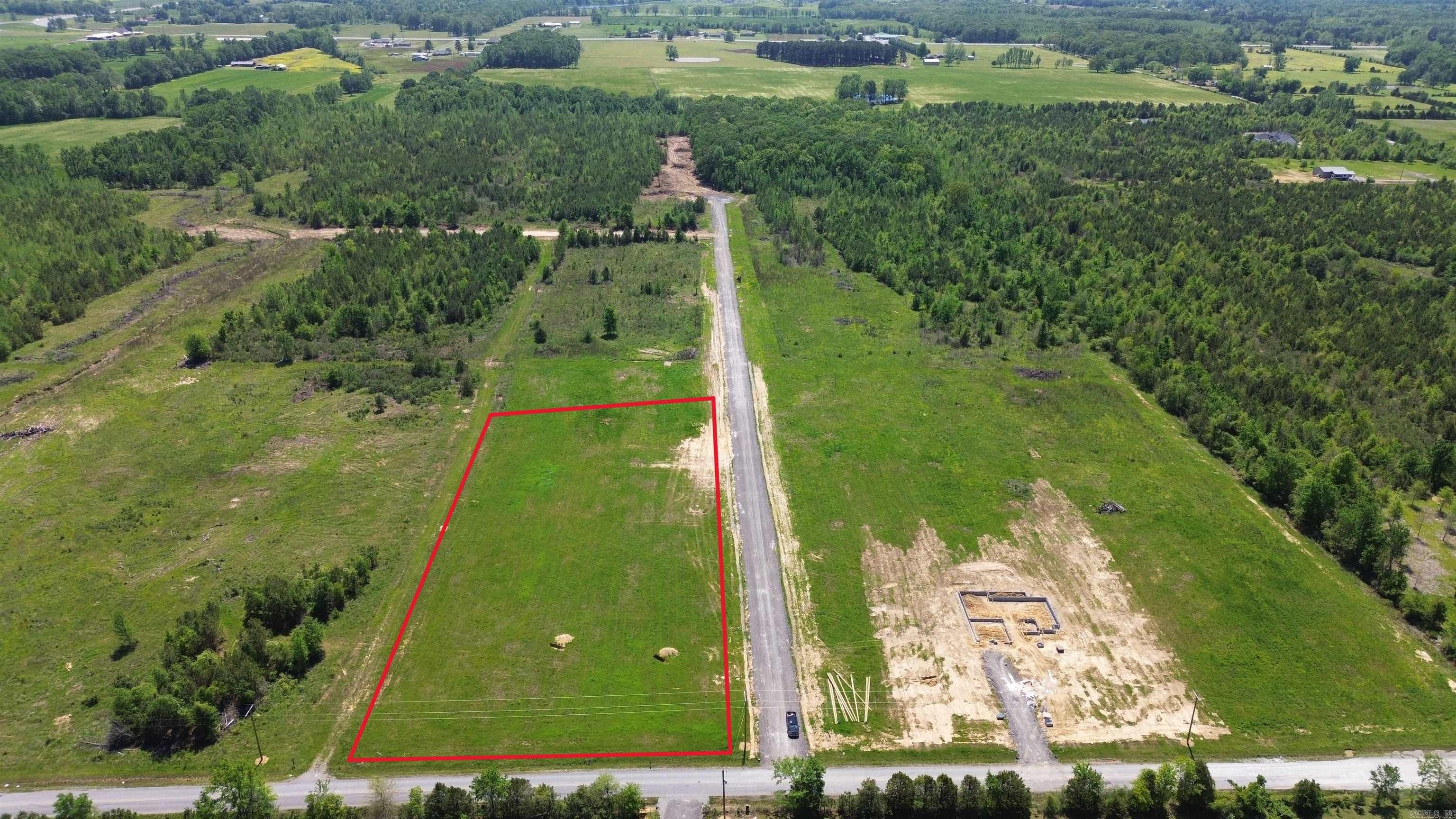 Beautiful flat 4.64+/- acre lot right outside of city limits, perfect spot if you are looking to build! Enjoy great views of the countryside in a quiet area while only being a few minutes from the interstate. 20 mins to Vilonia, 20 mins to Searcy, & 20 mins to Cabot. Water and electric are at the road. No mobile homes. Minimum square footage of 1800.