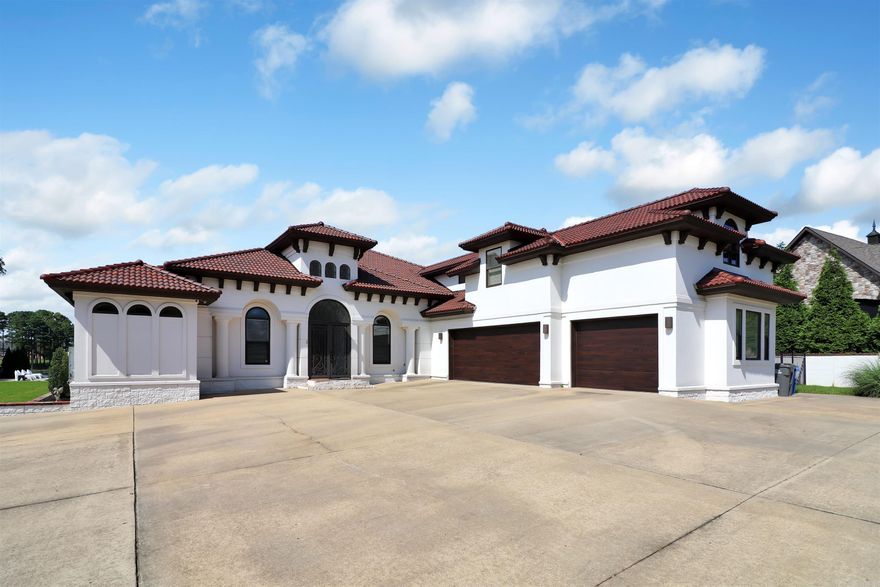 Mediterranean style home with golf course view.  4 beds/4 baths downstairs with and additional bonus room and bathroom upstairs.  Plenty of living space downstairs with formal living area, dining area, hearth room with fireplace, and breakfast nook. The kitchen is a chef's dream with many amenities.  Master suite has jet tub, double vanities and many other attractive features. Library/office just off master. Outside offers a salt water pool, wet bar, and wrap around patio.