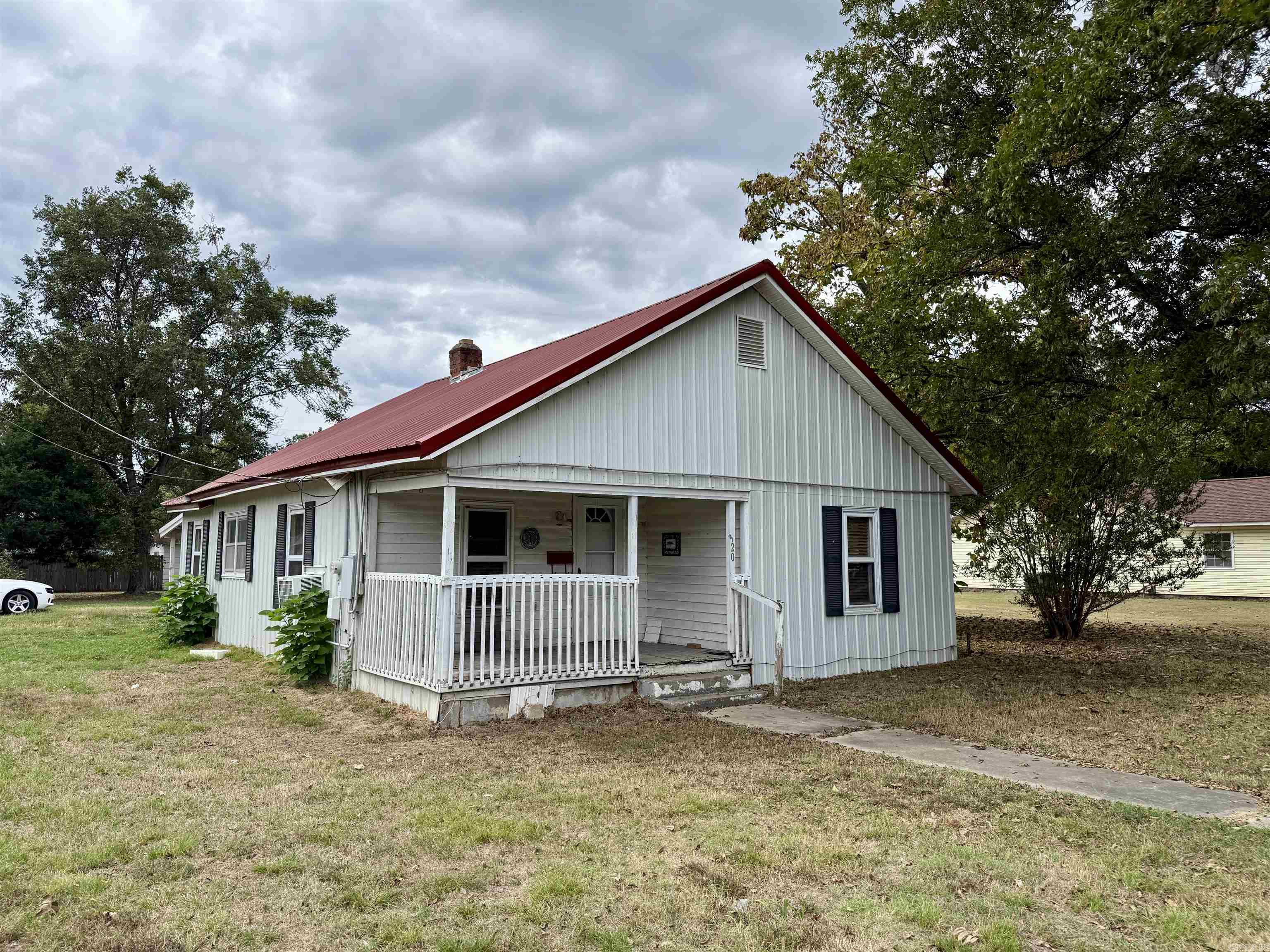 Charming Fixer-Upper Opportunity! This 2 bedroom, 1 bath home sits on a spacious lot just steps away from the school, making it a great location for families or an investment property. Featuring a metal roof, covered front porch, and plenty of yard space with mature trees, this home has tons of potential to be brought back to life. With a little TLC, you can make this house your own or turn it into a profitable rental. 2 Bedrooms / 1 Bath Metal Roof Large Lot with Mature Shade Trees Conveniently Located Close to School Don’t miss out on this affordable opportunity! Call today before its gone tomorrow!