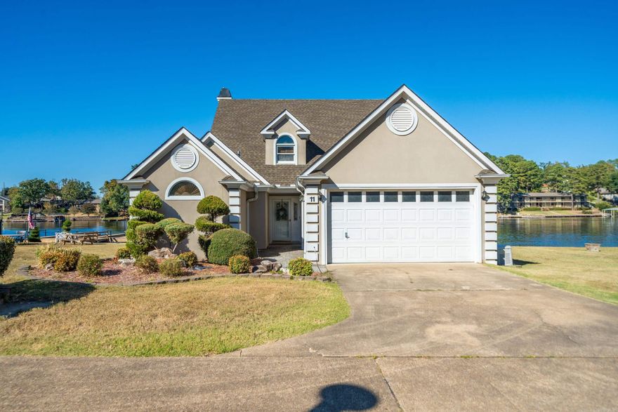 Stunning Lake Hamilton Waterfront Home,Fully Updated, Move-In Ready in Gated Neighborhood! Rarely does a Lake Hamilton waterfront home come on the market with such a perfect blend of modern updates and breathtaking views. This move-in-ready gem features a bright & airy layout, freshly painted in light, neutral tones that complement the wide-plank flooring & tasteful carpet. The kitchen & bathrooms have been beautifully remodeled, showcasing high-end countertops & finishes throughout. The primary suite offers a tranquil retreat with sweeping views of the lake, accompanied by a spa-like bathroom that boasts stunning tiled walls, a glass-enclosed walk-in shower, & elegant fixtures. Step outside to the covered deck, ideal for outdoor entertaining & enjoying the lakeside lifestyle. Access to the water is effortless, with no long stairs to navigate down to your private, deeded boat slip equipped with a boat lift. A whole-home Generac generator ensures peace of mind year-round, even when you're away. Plus, the property includes the adjacent vacant waterfront lot, giving you even more potential and privacy. Lots 13 & 14 available for purchase separately. Prime view of holiday fireworks!