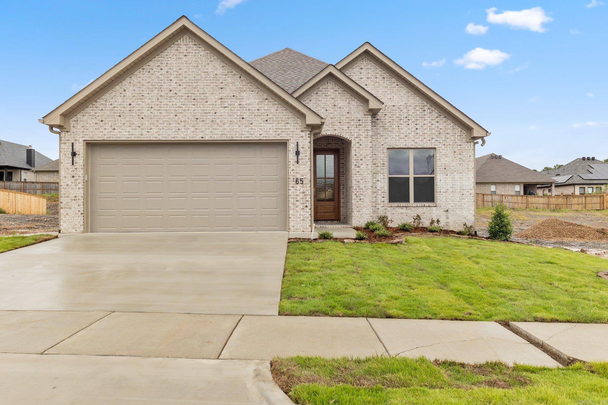 Welcome home to 65 Copper Circle! This home offers designer-curated finishes and a coveted location, all within the charming Copper Run Community of West Little Rock. Step into an open-concept floor plan that seamlessly blends functionality with visual appeal. Every inch of this home has been thoughtfully designed, featuring custom cabinetry, sleek quartz countertops, and stylish lighting and plumbing fixtures. The owner's suite is a serene retreat, boasting dual vanities, a soaking tub, an oversized walk-in shower, and a dream-worthy custom closet. With too many features to list, this stunning home truly has it all.