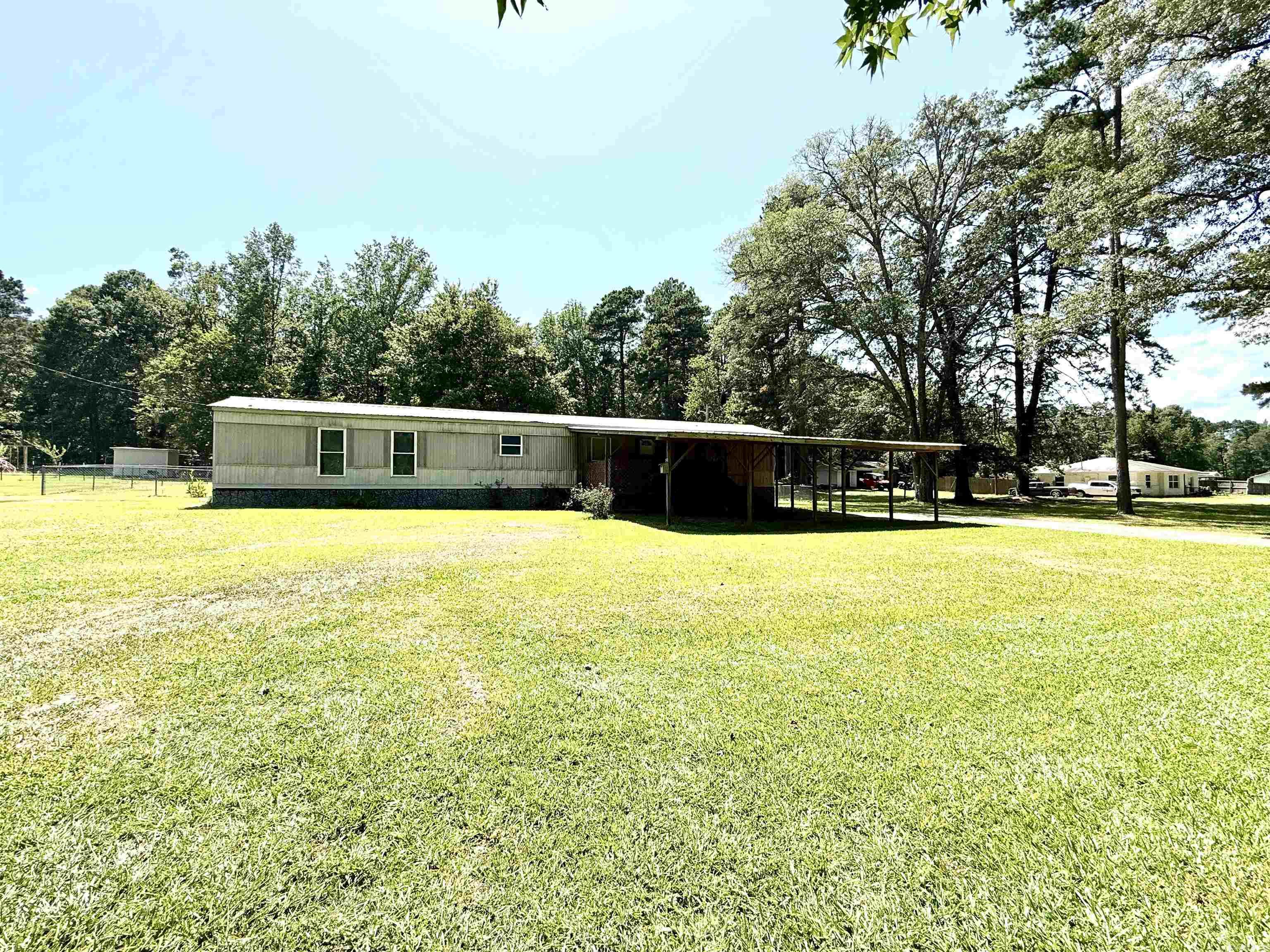 Welcome to 15217 Hwy 9 ā This 3 bedroom, 2 bath mobile home with a bonus room is situated on 1.17 peaceful acres just outside the city limits of Malvern. Built in 1997, this home offers comfort, convenience, and a touch of country charm with easy access to local amenities. Inside, youāll find laminate flooring throughout and a spacious layout that makes everyday living easy. The HVAC system was replaced approximately 6 years ago, and a new metal roof was added just last year, giving you peace of mind for years to come. Enjoy the outdoors with a covered carport, and a storm cellar for added security. Plus, donāt miss the versatile outbuilding thatās perfect as a man cave or she shed or to use for storage, complete with a pool table and air hockey tableāa great space for relaxing or entertaining guests. Property is being sold "as is" Donāt miss this unique propertyāschedule your private showing today!