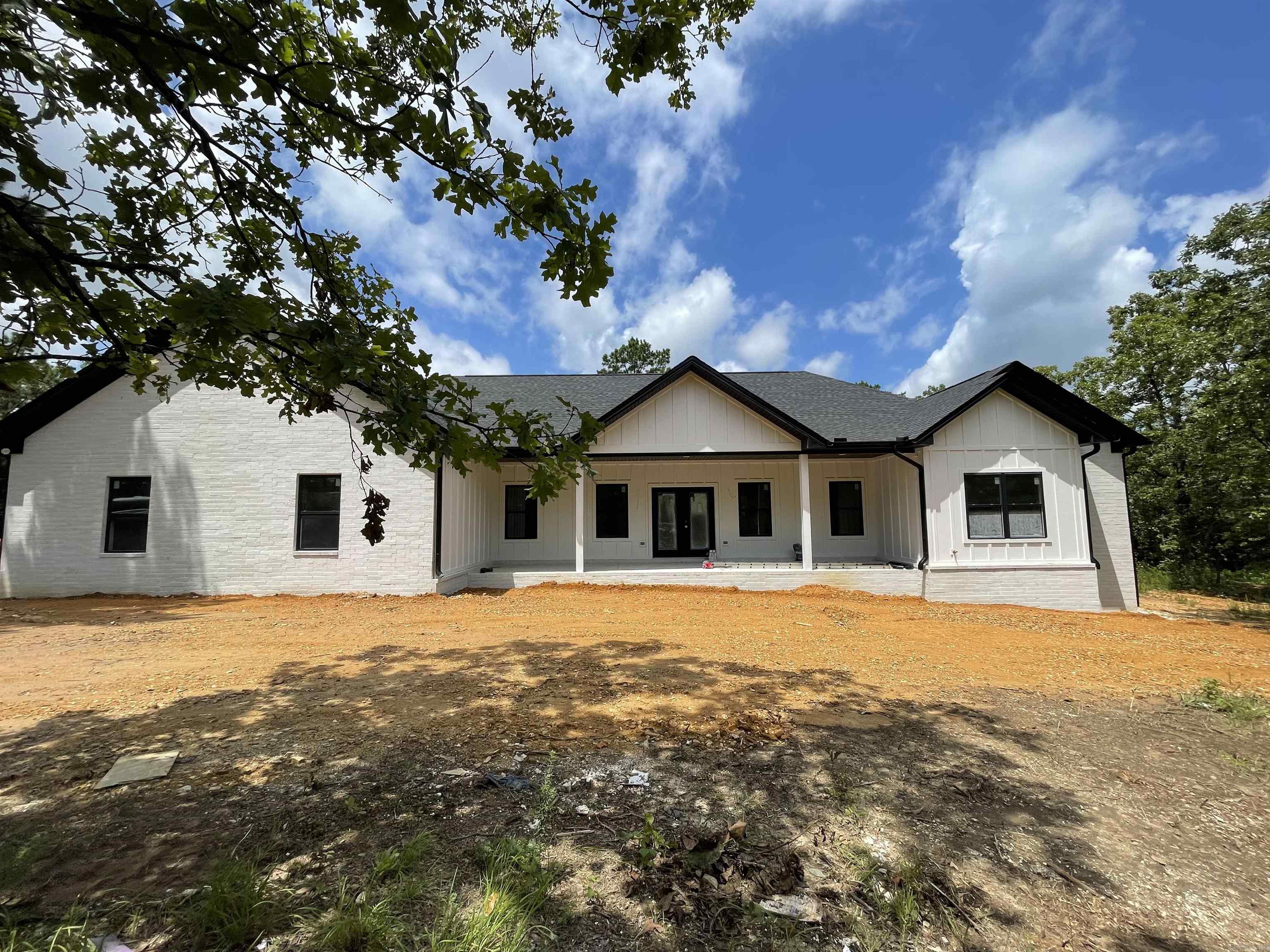 New construction craftsman home complete with open concept, large primary, complete with custom shower and garden club. Hickory Hardwood flooring being installed today (June 31), Quartz countertops, Butlers pantry, top of the line appliances and gold/black/ neutral accents throughout. Enjoy your privacy on 1.23 acres, and entertain guests on your covered front porch, or simply kick back and relax on your back porch. Only 3 minutes to I-40, and 7 minutes to Dave Ward, and 5 minutes to Downtown Mayflower, you literally have groceries, shopping, banking, and medical just minutes from you!! Estimated completion 3rd week in July.
