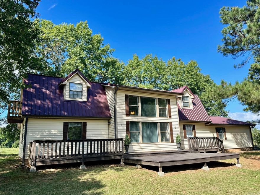 Beautiful updated home on approximately 1 acre near Lake Ludwig. This charming 3-bedroom, 2-bath, 2,188 sq ft two-story home offers space, comfort, and a peaceful country setting. Situated on a lovely 1-acre lot with mature trees ,this property provides both shade and privacy along Highway 21. The home has been thoughtfully updated throughout, blending modern touches with cozy character. Enjoy spacious living areas, a functional layout, and plenty of natural light. A storm shelter adds peace of mind, while the surrounding trees create a beautiful outdoor backdrop perfect for relaxing or entertaining.