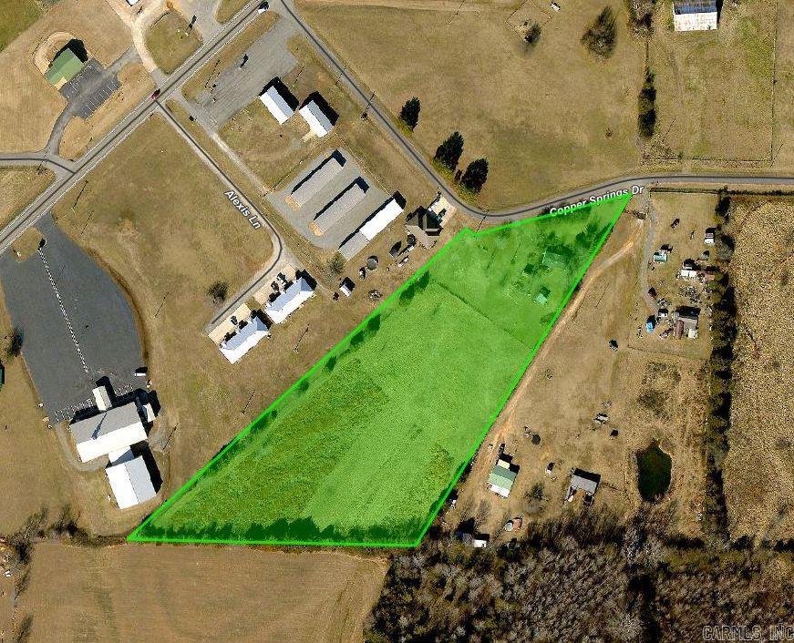 Vacant land has an old mobile home on it that probably needs to be hauled away. Land has electric, septic, and water. There is a wooden storage building on the land that will convey with the right offer.