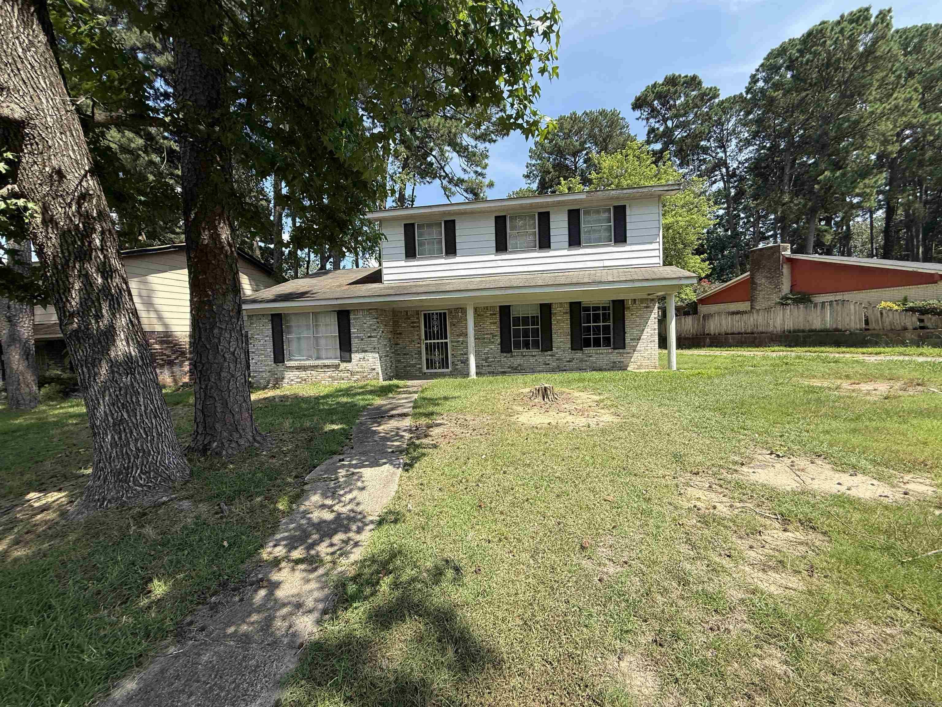 Spacious and well-laid-out 4-bedroom, 2.5-bath home offering over 2,000 sq ft. Built in 1967, this classic home features a blend of original character and modern updates throughout. The home boasts a large living area and generously sized bedrooms. The kitchen offers ample cabinet and counter space, perfect for home chefs or entertaining. The primary suite includes a private en suite bath, with additional full and half baths thoughtfully located for guests and family. Situated on a shaded lot with mature trees and a fenced backyard, this property provides both privacy and space to enjoy the outdoors. Carport and driveway parking included.