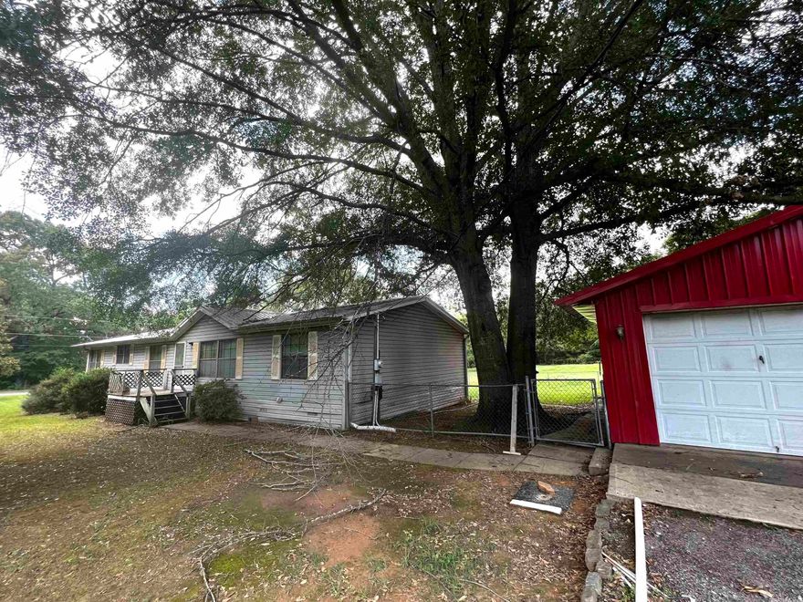 Mobile on 2.18 acres with large shop w electricity!  This is an estate sale so there is very little info about the property - buyer should confirm everything.  Seller is uncertain whether mobile is on a permanent foundation. Property sold as is, where is with no property disclosure and seller will do no repairs.  Butane tank is believed to be leased.  Tons of potential, pretty land, very nice shop!  Agents see confidential remarks.