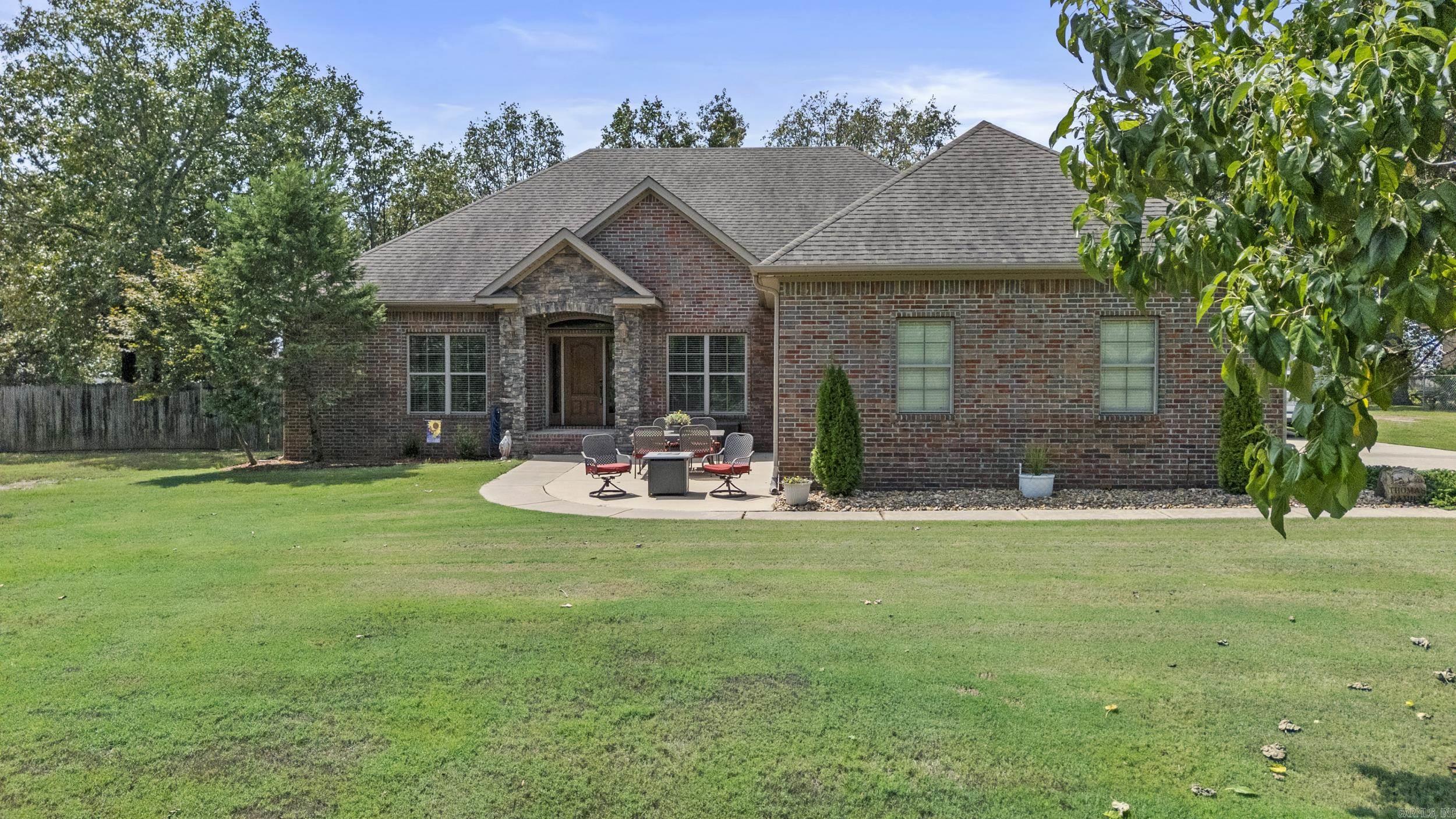 Beautiful Brick Home on 1 Acre with Split Floor Plan, Bonus Room and Workshop. You Must See this Stunning home on this spacious 1 acre lot which offers a wonderful floorpan for optimal privacy and comfort. The large Master suite is on 1 side of the home and features a see-through fireplace, a luxurious Jacuzzi tub and a spacious walk-in closet, while 2 additional bedrooms share a convenient Jack & Jill bath on the opposite side. Step into the open concept great room with a cozy Fireplace.The kitchen features granite counters, an island and has quality finishes. Upstairs a bonus room offers flexible space. Side loading garage plus an additional workshop/garage. Extra large yard with Storage building. Sprinkler System and a Safe Room!! HVAC 2024. See Remarks