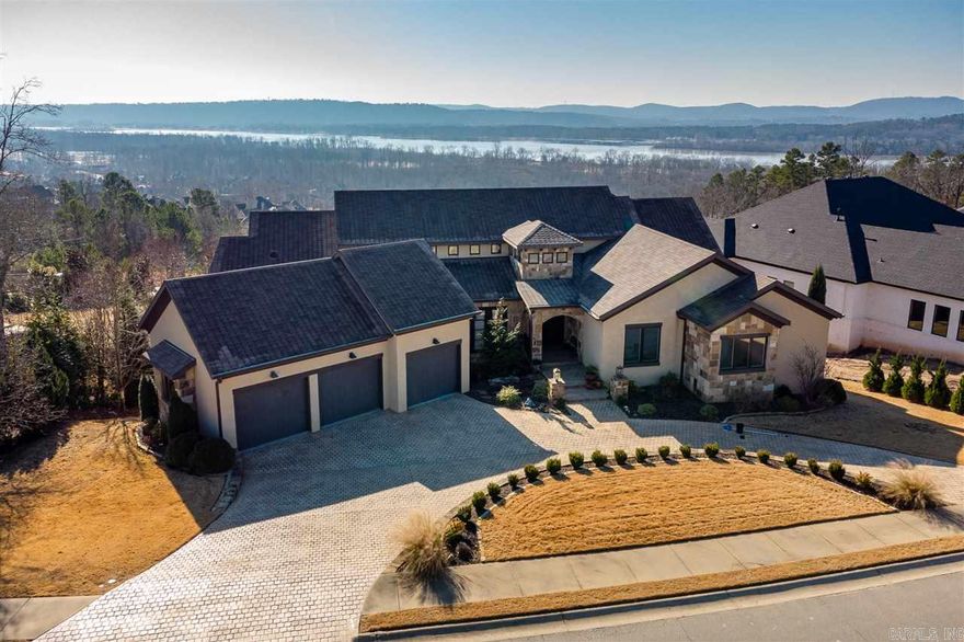 Luxury estate is a soft contemporary w/priceless views of AR River. Elegant entertaining on patios, gunite pool, outdoor kitchen, outdoor FP and pergola. 11' & 13' ceilings, open floor plan, hickory floors, barrel ceiling hall, 2 laundry rooms, mudroom, elevator, & generator. Gourmet kitchen- quartzite counters, Wolf 6 burner gas, 2 DWs, double oven, massive island. Coffee bar in master suite w/connecting laundry. In-law quarters w/kitchen & den. Control 4 system, central vac., low utilities w/Geothermal.