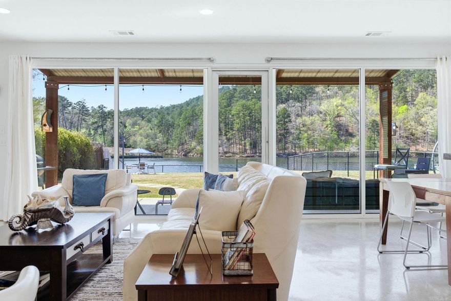 Lakefront.  One of the top views on Lake Hamilton.  National Forest is across the water from the home.  Herons, geese, ducks, bald eagles, deer, mink, etc. all seen from this property.  Modern craftsman house.  Boat dock and boat house.  Floor to ceiling windows lets the light flood in.  Your own stunning lakefront retreat or use as a short term rental.  For more pictures and description visit VRBO 1190260.  No POA dues.