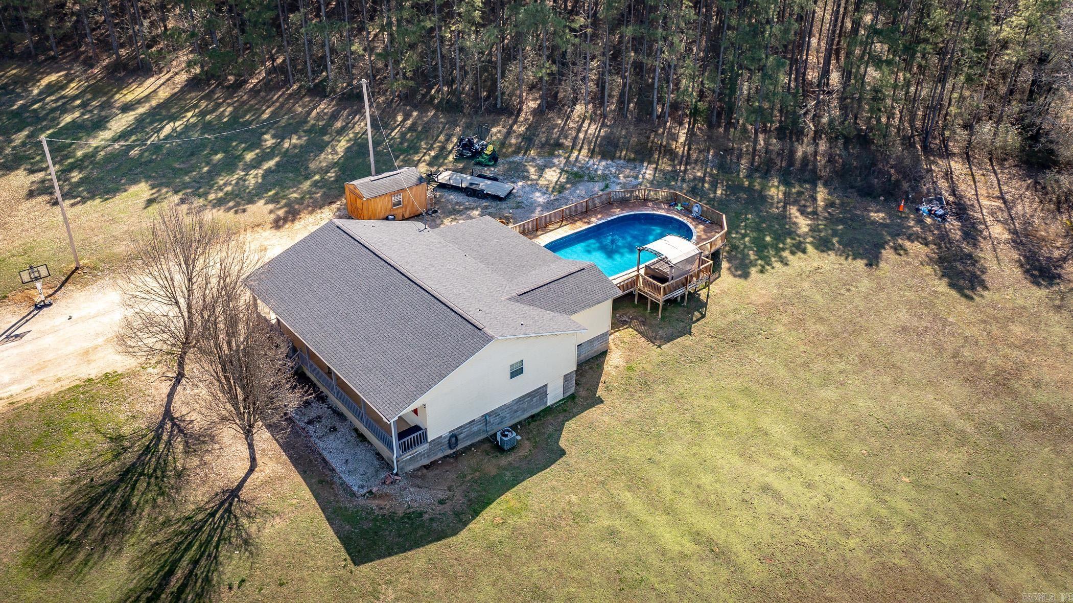 Discover the perfect blend of comfort and convenience in this 4 bedroom, 2 bath home, offering 1,889 sqft and nestled on 5 acres in the heart of Bismarck, AR. Featured amenities include a large pond, huge 1,312 sqft deck, a 43x23 saltwater pool put in 2021, a hot tub that is only a year old and a brand new 6ft privacy fence. This is the perfect space for entertaining or unwinding after a long day. This property is also only 1 mile from Bismarck School District, less than 5 minutes from Lake Degray and a short 20 minute drive to both Hot Springs and Arkadelphia. Enjoy the peace of country living while having easy access to schools, outdoor recreation and city conveniences. Seller is now offering $5,000 in concessions with an acceptable offer. This can be used toward closing costs, rate buy-down or updates to the home.