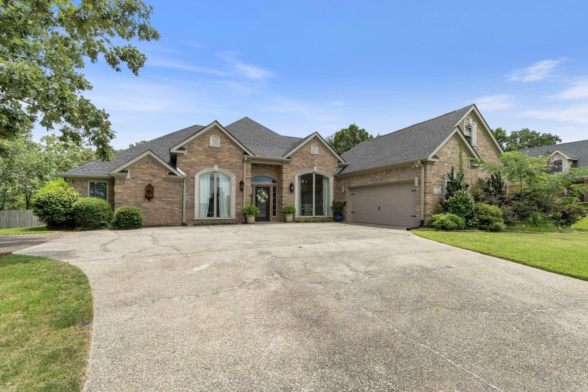This beautiful home located in the gated Stonegate Subdivision could be yours! Thoughtfully renovated throughout, this home features engineered wood flooring, new light fixtures, granite countertops in the kitchen and downstairs bathrooms, updated sinks and toilets, a new roof, gutters, garage door, and two brand-new HVAC units. The open-concept kitchen flows seamlessly into the spacious living room and breakfast nook. Enjoy stunning views of Mt. Riante and glimpses of Lake Hamilton. Additional highlights include an elegant formal dining room, a media room or ideal office space, and separate in-law quarters or a detached office just off the expansive back deck. The deck spans nearly the entire width of the home and offers plenty of space to relax or entertain. An extra lot to the east of the fenced backyard provides space to create your dream outdoor oasis. Enjoy all the amenities of Stonegate Subdivision, including a private boat launch and storage, swimming pool, clubhouse, and tennis courts.
