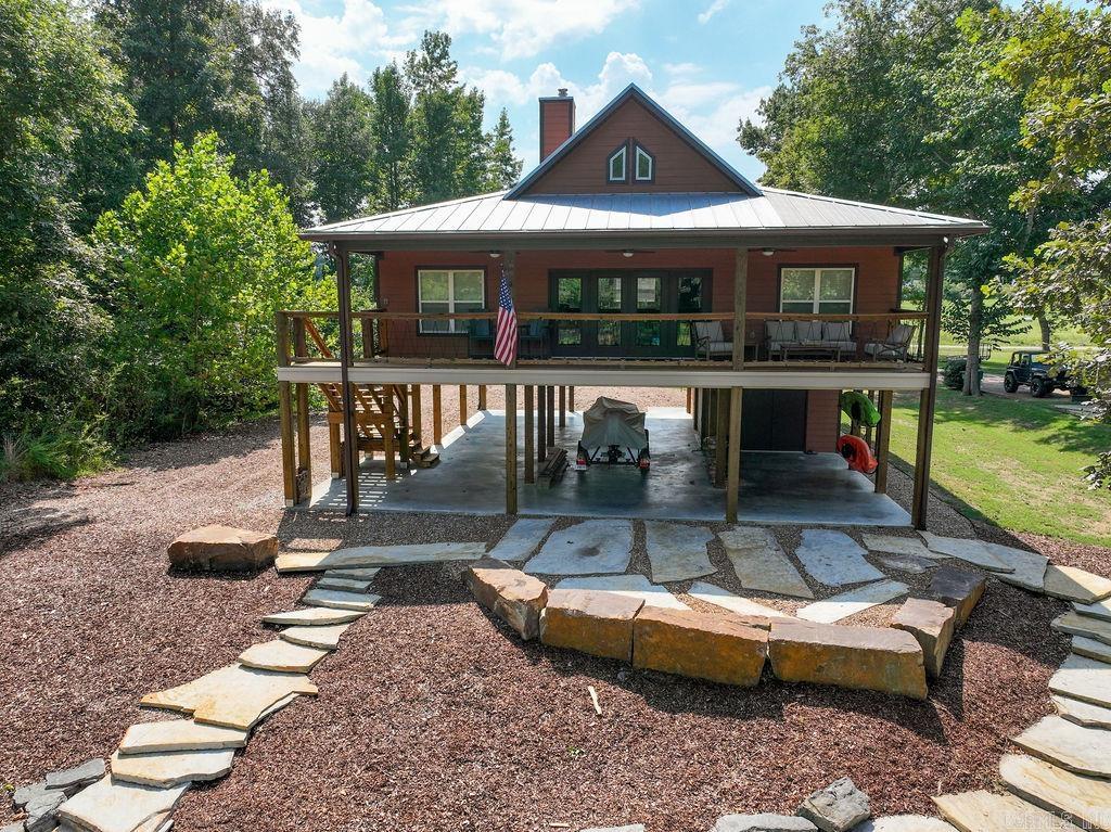 HEBER SPRINGS-WALK-IN-FLY FISHING / ONE OF A KIND!! Own the ultimate riverfront escape with unrivaled walk-in fly fishing access on the Little Red River. Marvel at breathtaking Sugarloaf Mountain views from nearly every room in this open-concept haven. This furnished home features custom white oak woodwork, vaulted ceilings, and luxury vinyl floors create a warm, elegant vibe but feature ever-lasting durability. The gourmet kitchen boasts granite counters and stainless steel appliances, while a cozy woodburning stove adds charm. The ample storage options keeps life organized when running in and out of river. Nestled in a tranquil neighborhood, this sanctuary ensures peace and privacy. Perfect for those craving luxury, serenity, and world-class fly fishing but not wanting to spend a million dollars. This one is sure to check all the boxes, so call today for your private viewing.