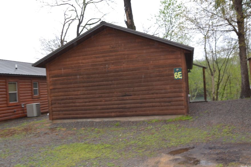 Investment property with great clientele.  Low maintenance and energy efficient.  Very neat riverfront cabin with a deck and boat slip in the community dock.  Comes fully furnished and has a jon boat in its own slip that conveys.  It is ready for your personal pleasure or to rent.  Walk off of your deck into one of the largest wadable fishing areas on the Little Red River. Minutes from Sugarloaf Mountain, Greers Ferry Lake, restaurants, and shopping.  Housekeeping is available upon request.  There is a community laundry and a pavilion for your private use.