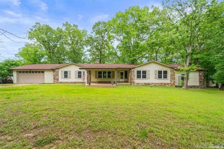 Spacious 6-Bedroom Home on 1.5 Acres in Lake Hamilton School District Welcome to this well-maintained 6-bedroom, 3-bathroom split-level home offering 3,440 sq ft of living space on a fully fenced 1.5-acre lot. Located in the desirable Lake Hamilton School District, this property features an updated roof (2023), new gutters (2024), brand-new HVAC, heat pump (2025), two new 40-gallon water heaters(2024), and professionally cleaned air ducts. Enjoy multiple living areas, a cozy wood-burning fireplace, a covered front patio with ceiling fan, and a spacious backyard with a deck—perfect for entertaining. Additional features include an attached 2-car garage, two storage sheds, and a paved driveway. Ideal for large families, multi-generational living, or flexible home use. Conveniently located near schools, shopping, lakes, and parks—this move-in ready home offers comfort, space, and modern updates.
