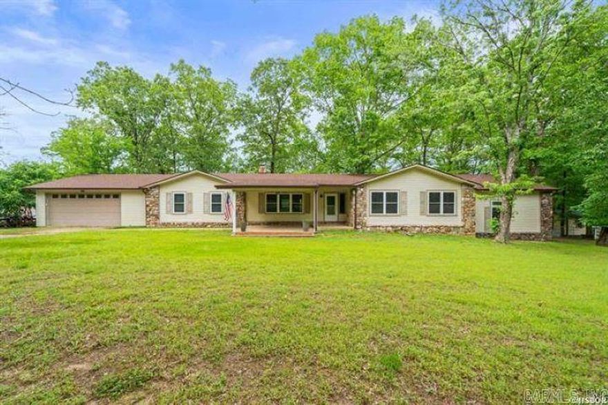 Spacious 6-Bedroom Home on 1.5 Acres in Lake Hamilton School District Welcome to this well-maintained 6-bedroom, 3-bathroom split-level home offering 3,440 sq ft of living space on a fully fenced 1.5-acre lot. Located in the desirable Lake Hamilton School District, this property features an updated roof (2023), new gutters (2024), brand-new HVAC, heat pump (2025), two new 40-gallon water heaters(2024), and professionally cleaned air ducts. Enjoy multiple living areas, a cozy wood-burning fireplace, a covered front patio with ceiling fan, and a spacious backyard with a deck—perfect for entertaining. Additional features include an attached 2-car garage, two storage sheds, and a paved driveway. Ideal for large families, multi-generational living, or flexible home use. Conveniently located near schools, shopping, lakes, and parks—this move-in ready home offers comfort, space, and modern updates.