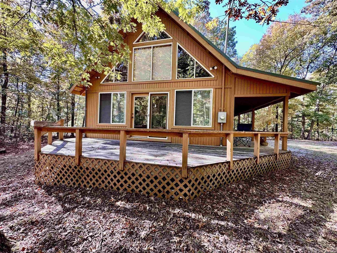 Situated right on the outskirts of Mountain View, this A framed cabin situated on 3.04 acres offers privacy while also being close enough to town to enjoy all that the town square has to offer. This property has 2 bedrooms and 1.5 bathrooms, plus an amazing loft with built-ins giving you ample space for your storage needs. The open floor plan provides an atmosphere perfect for family gatherings while the wraparound deck provides an extension of your living space. Perfect for enjoying your morning coffee or having a barbecue in the evenings. The surrounding area is rich with natural beauty, making it an ideal spot for outdoor enthusiasts. You can enjoy hiking, fishing, or simply exploring the scenic landscapes that the Ozark National Forest has to offer. This property with its unique blend of comfort, functionality, and connection to nature, making it a wonderful place to call home or a perfect retreat from the hustle and bustle of everyday life. Schedule your showing today!