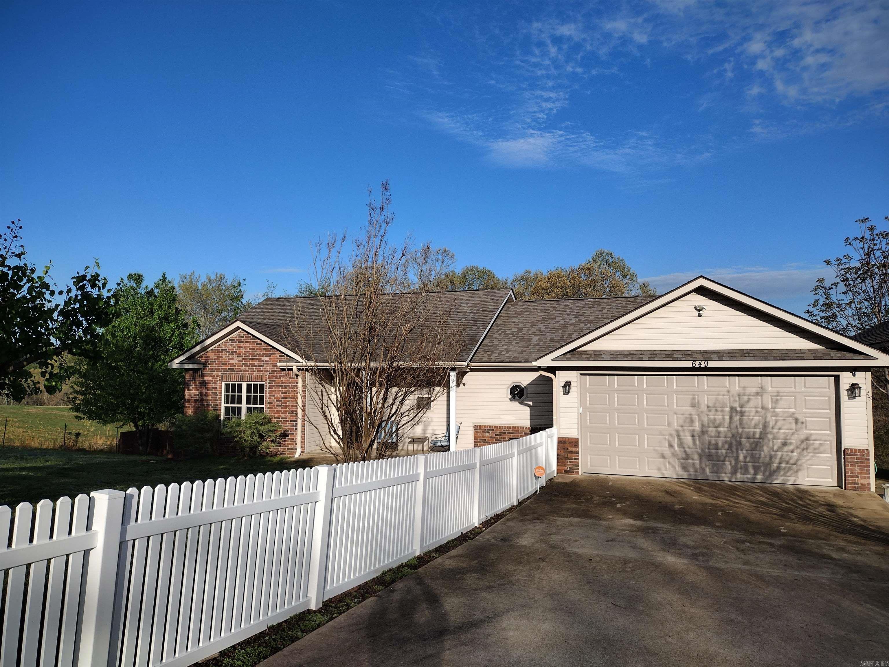 This spectacular residence boasts 4 bedrooms, 3 bathrooms, a basement that could be used for multiple things such party room, game room, in-law suit, income producing or as a bedroom with a full bath and closet; 2-car garage and RV storage, complemented by a concrete driveway and nearly new whole house generator. The heat and air unit is less than 2 years old, the roof 2-year-old and the kitchen cabinets and pantry include rollout shelves. Alarm system with indoor, outdoor cameras. This well-maintained home is set amidst a very nice yard and also has a sunroom to sit and enjoy the great scenery. This one will go fast, so call today! Motivated seller