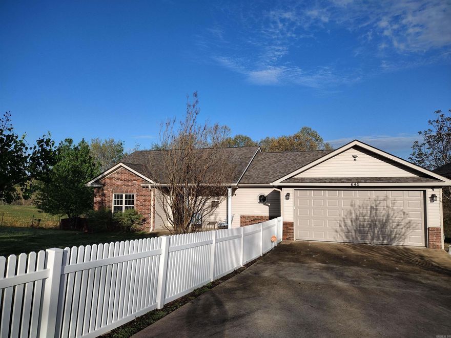 This spectacular residence boasts 4 bedrooms, 3 bathrooms, a basement that could be used for multiple things such party room, game room, in-law suit, income producing or as a bedroom with a full bath and closet; 2-car garage and RV storage, complemented by a concrete driveway and nearly new whole house generator. The heat and air unit is less than 2 years old, the roof 2-year-old and the kitchen cabinets and pantry include rollout shelves. Alarm system with indoor, outdoor cameras. This well-maintained home is set amidst a very nice yard and also has a sunroom to sit and enjoy the great scenery.  This one will go fast, so call today! Motivated seller