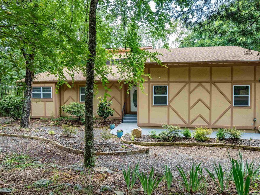 RECENTLY UPDATED 4BED 3 BATH HOME MINUTES FROM LAKE BALBOA! Experience serenity in this peaceful & private corner lot on a cul de sac, surrounded by nature and wildlife, yet just minutes from desirable amenities. Enjoy the convenience of multiple golf courses, nature trails, a dog park, a sandy beach, tennis, fine arts, & pickleball all just 5-10 minutes away! Outside, unwind on the extended deck, soaking up the soothing sounds of nature. Inside, find the perfect blend of versatility & comfort, ideal for multigenerational living or a fantastic rental opportunity with dual rental space. On the main level, indulge in the spacious primary en-suite with a spa-like walk-in shower & a large walk-in easy access bathtub! A smaller second bedroom, currently used as a home office, offers flexibility. The fully updated kitchen boasts new granite, a double oven, new tile floors, & new appliances, perfect for culinary delights. The airy living area features premium hardwood flooring & a cozy wood-burning fireplace. A laundry/utility room provides ample storage. Downstairs, explore two bedrooms, one full bath, an additional large living/dining area! Many updates including a new roof! Call today!